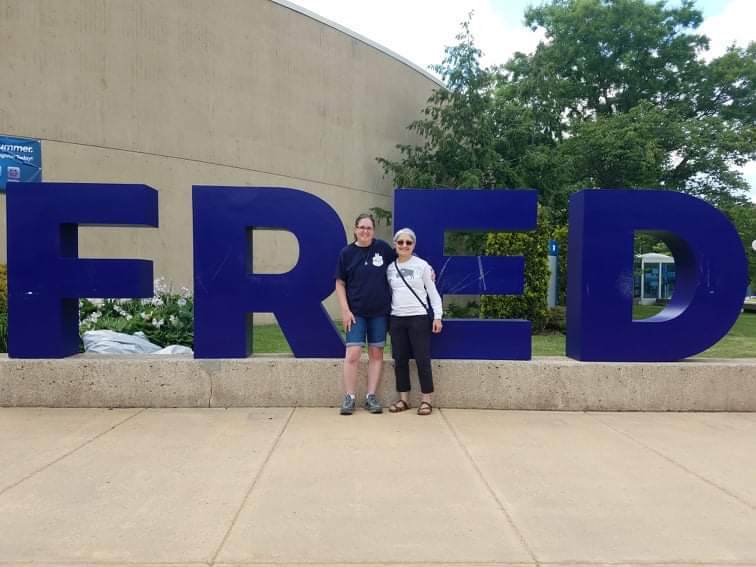 Me and Dr. Mira Berkley standing in front of the FRED sculpture at SUNY Fredonia.